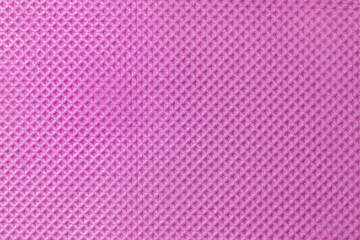 A close-up of a pink textured surface, showing intricate details and vibrant color.