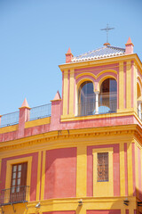 Building exteriors along the narrow streets of Seville, Spain