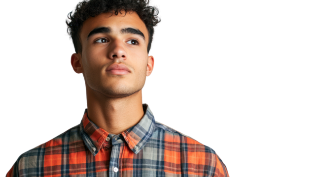 A young man gazing upwards, wearing a stylish plaid shirt, looking thoughtful and contemplative against a white isolated background.
