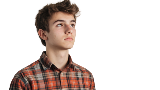 Thoughtful young man in a plaid shirt, looking upward with a contemplative expression against a white background.