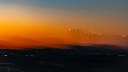 The image showcases the beauty of intentional camera movement (ICM) photography, blending vivid...