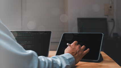 Developer interacts with code on tablet, dynamic workspace rich in technology and creativity scene highlights integration of programming and modern tools
