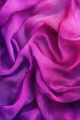 Obraz premium Vibrant, soft purple paisley scarf on a gray background.