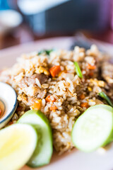 Fried rice topped with scrambled egg, style Thai food in white plate ready to eat