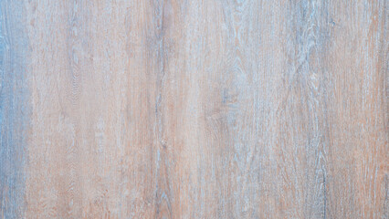 Obraz premium A wooden wall with a blue and white color scheme. The wall is made of wood and has a natural texture