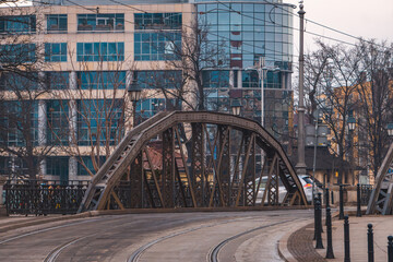Fototapeta premium steel metal bridge over the river. metal structure of the bridge.