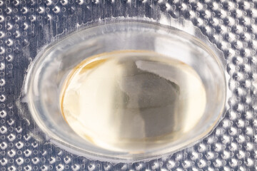 Extreme close up of gel capsule in blister pack