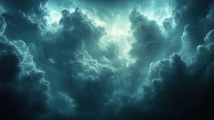Fototapeta premium A dramatic sky filled with dark, swirling clouds illuminated by a soft, ethereal light, creating a mysterious and atmospheric scene.