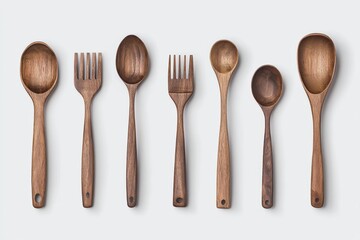 A set of wooden utensils, including spoons and forks, arranged neatly on a light background, showcasing their natural texture and craftsmanship.