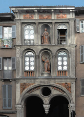 One of the two facades of Teatro Fossati with terracotta decorations, including a statue of Giuseppe Garibaldi in Milan, Italy