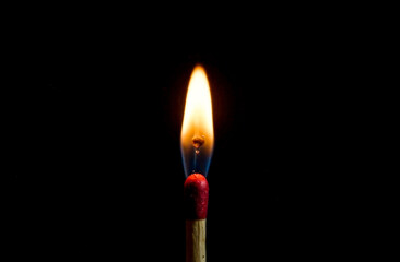 a burning match on a black background. safe handling of fire. international Match Day