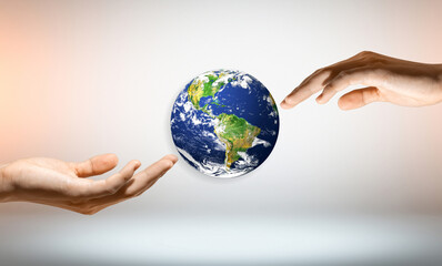 Hands Holding Earth with a white Background and a Symbol of Unity