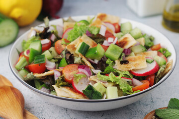 A bowl with Fattoush - Traditional Levantine salad