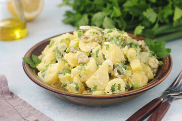 A bowl with Greek potato salads