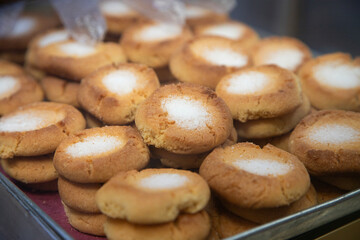 Traditional sweets stand with empanadas, cocadas, mamones in the Oaxaca food market.