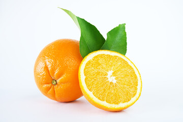Fresh oranges with slices isolated on white background