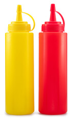 Red and yellow plastic dispenser bottles for ketchup, mustard or other sauce isolated on white background. File contains clipping paths.