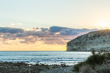 Sunset at Cyprus Beach: Pastel Colors, Clouds over the Sea, Rocky Cliff