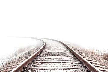 Winter Railroad Tracks Curve into Foggy Distance