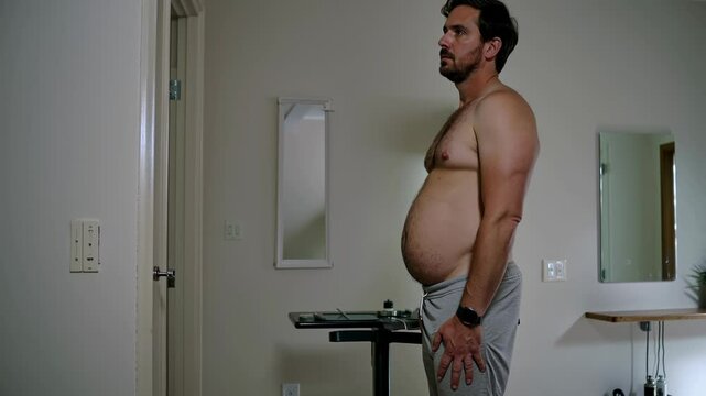A man in his 40s upset about his belly and low fitness.