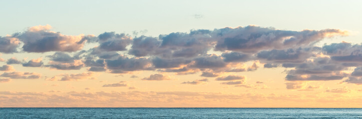 Sunset at Cyprus Beach: Pastel Colors, Clouds over the Sea, Rocky Cliff