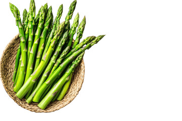 Fresh green asparagus arranged in a woven basket on a white surface with natural lighting