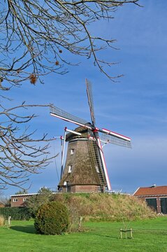 Mill Ons Belang in the small Gelderland village of Linde  in winter, with festive red-white-blue strips on the mill wings.