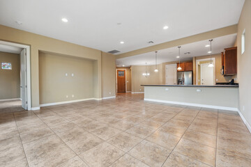 Spacious living room with wooden flooring and sliding doors leading to a bright outdoor area