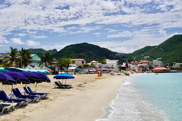 Empty but ready at 9:30am, Great Bay beach will be bustling with tourists taking in the sun later on in the day. This view is towards the east.