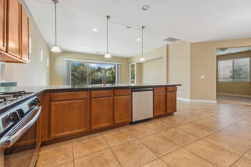 a home kitchen with countertop and cabinets