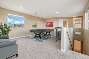 a game room with a pool table