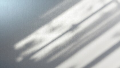Soft abstract shadows on smooth grey surface with natural light effect