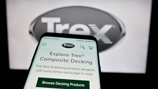 Stuttgart, Germany - 01-15-2025: Mobile phone with website of US decking business Trex Company Inc. on screen in front of business logo. Focus on top-left of phone display.