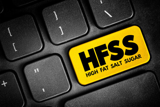 HFSS (High Fat Salt Sugar) acronym - term for food and beverage products which are high in saturated fat, salt and sugar, text button on keyboard, concept background