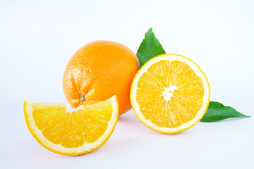 Fresh oranges with slices isolated on white background
