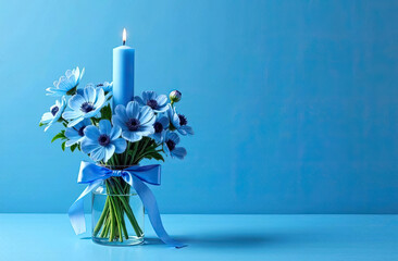 Beautiful blue flowers and candle create a serene atmosphere on a calm, bright background