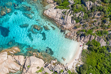Spiaggia Delle Vacche, Cala Girgolu with pine trees and turquoise water