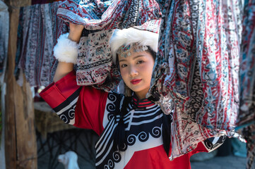 Obraz premium Young pretty Mongolian girl in traditional costume with handmade clothing