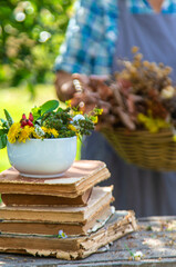 Medicinal herbs alternative medicine old woman. Selective focus.