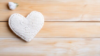 Fototapeta premium Handmade crochet red heart on rustic wooden table, symbol of love, warmth, and craftsmanship
