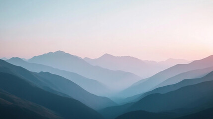 Fototapeta premium Serene layers of mountains at dawn with soft pastel colors in the sky