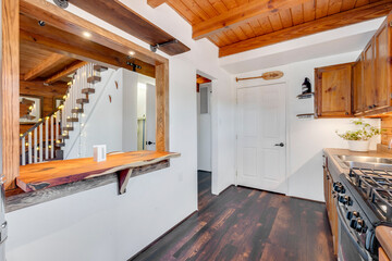 a home kitchen with countertop and cabinets
