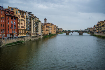 Colorful architecture of Florence on the banks of the Arno river and Santa Trinita bridge, ITALY