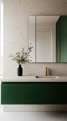 A modern bathroom featuring a green cabinet, minimalist design, a mirror, and a stylish vase with greenery, all set against a textured wall.