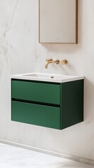 A modern green bathroom vanity with a white sink and golden faucets, complemented by a minimalist mirror above, set against a marble wall.