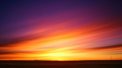 Obraz premium A stunning sunset with vibrant hues of orange, purple, and pink blending across the sky, creating a serene and picturesque landscape.