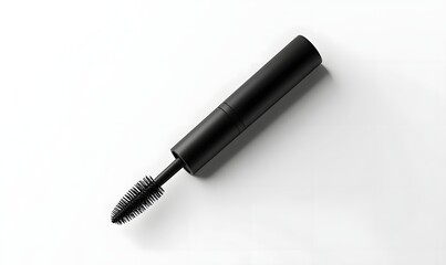 Black mascara tube and wand on white background.