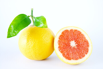 Fresh grapefruits with slices isolated on a white background