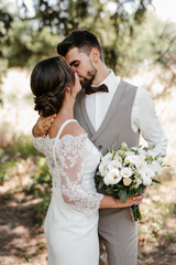 guy and a girl newlyweds are walking in the forest
