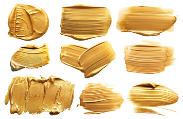 Gold paint strokes on white background, set